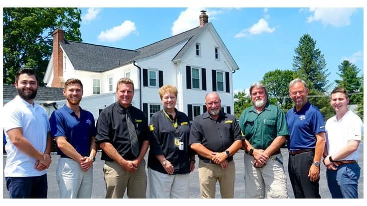 Pictured (left to right): Nick Aust, Chris Aust, Robert Schwenker, Eve Pappas, William Hoffman, Jim Murphy, Stuart Aust and Dan Aust.